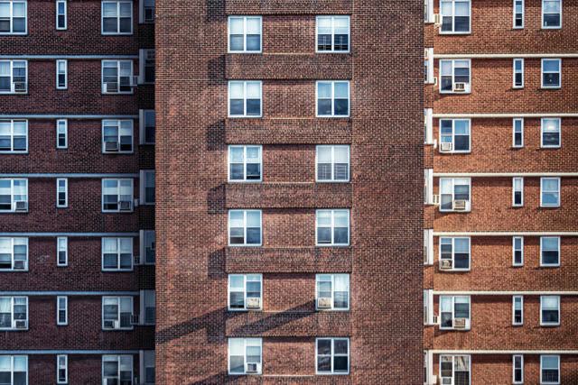 Three buildings with various windows