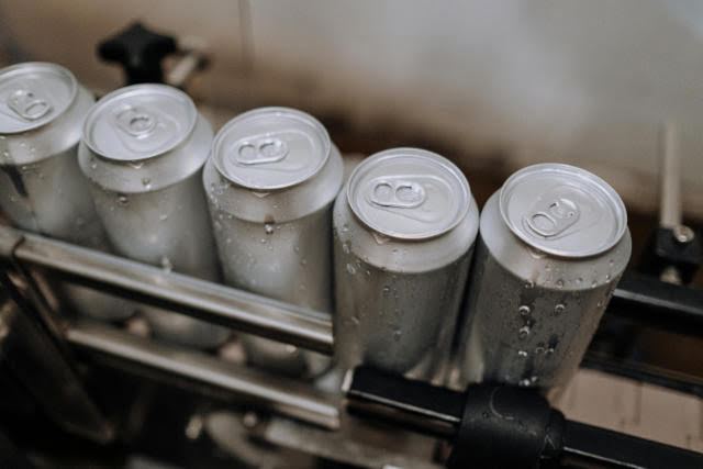 Collection of cans on an assembly line